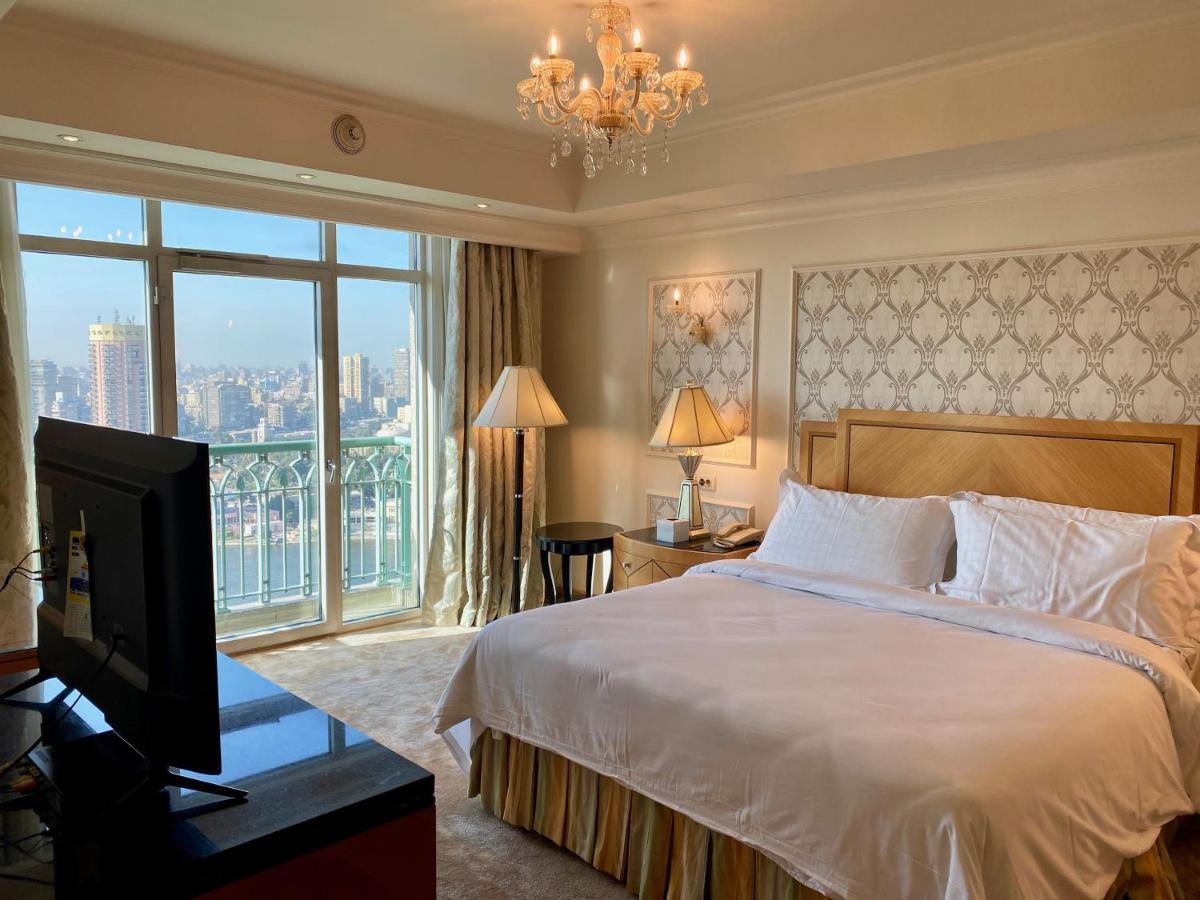 Chez Haytham At Four Seasons Nile Plaza Residential Suite Kairo Bagian luar foto