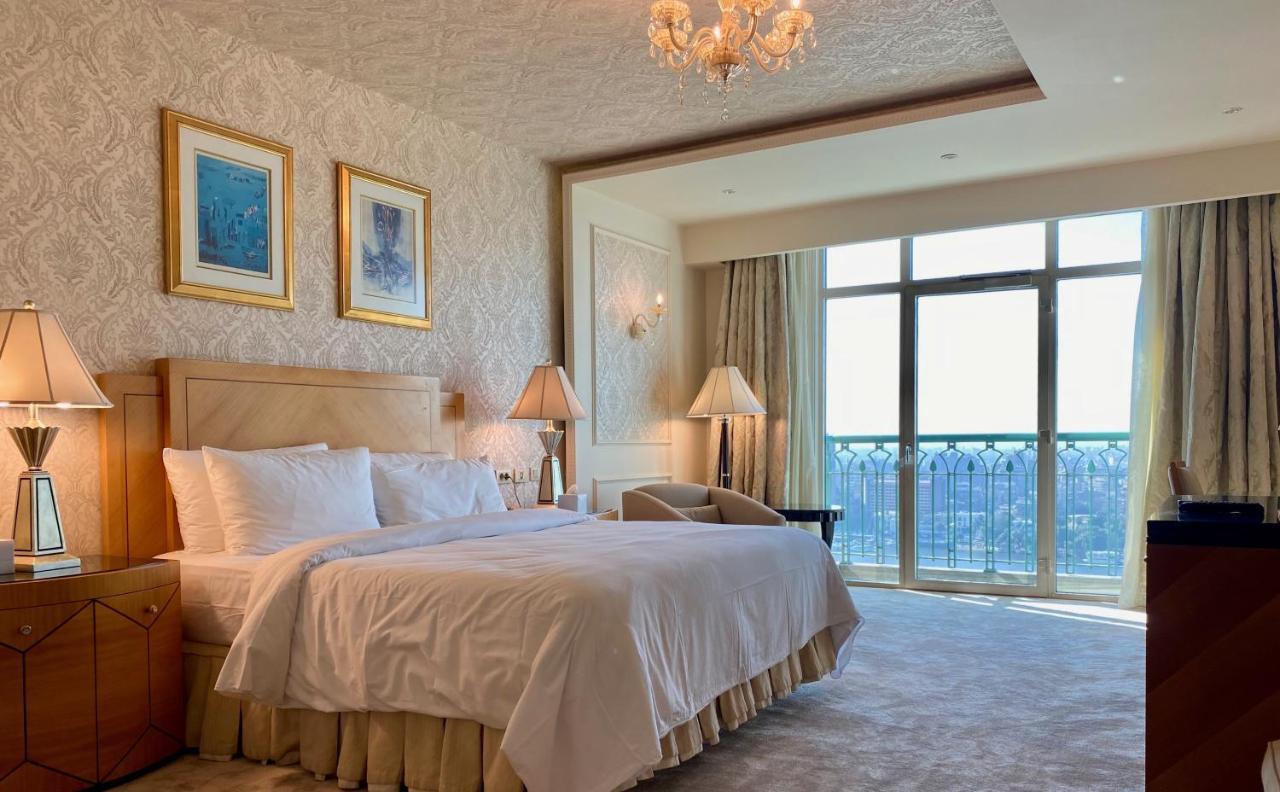 Chez Haytham At Four Seasons Nile Plaza Residential Suite Kairo Bagian luar foto